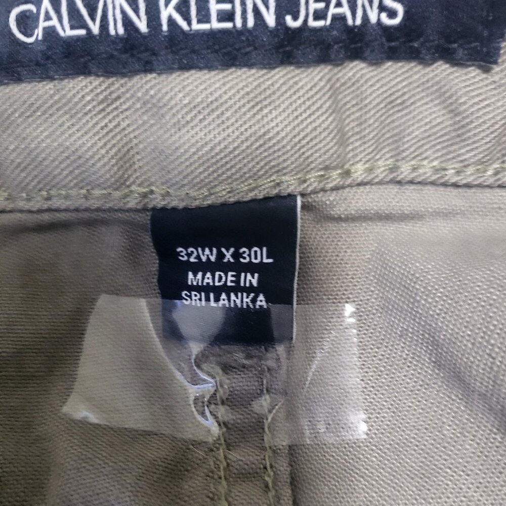 Calvin Klein Men’s cool green jeans, slim fit; 32(W) x 30(L), great condition! $